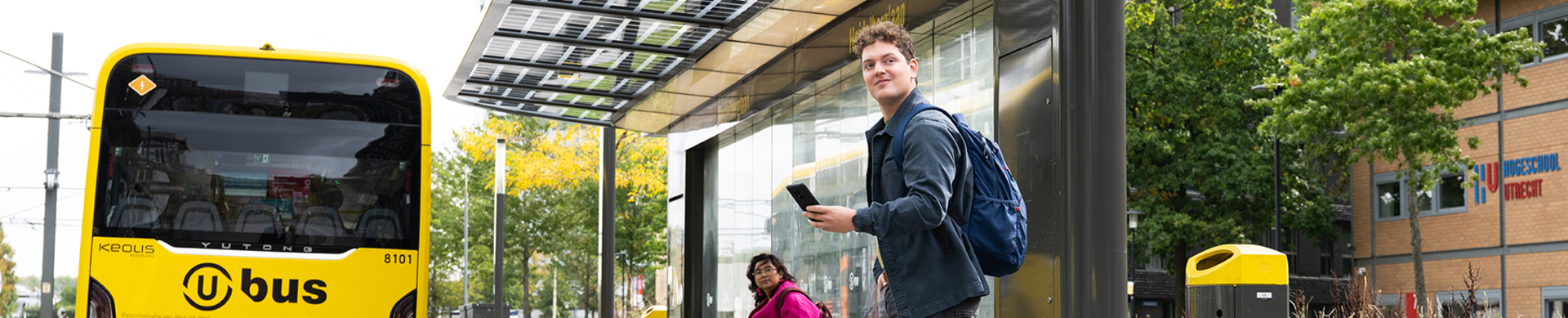 Man at bus stop Utrecht Science Park